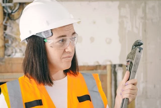 plumber holding a spanner