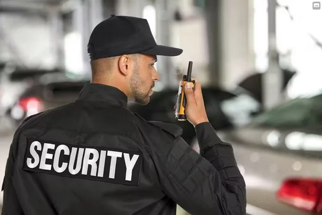 security guard on talking on his radio
